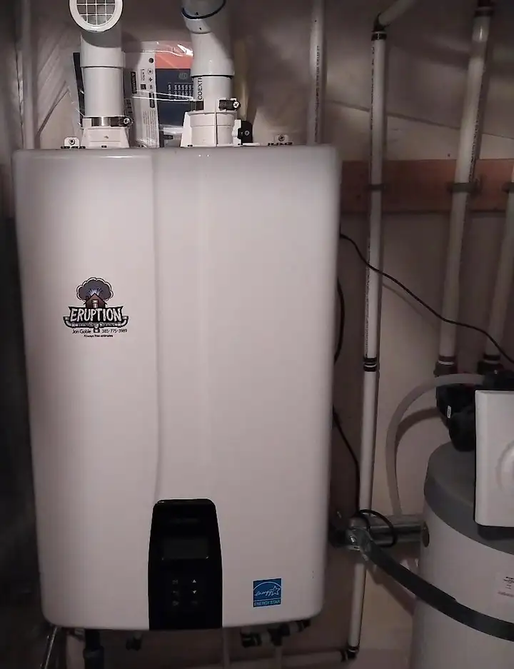 Wall-mounted tankless water heater with gas and water connections